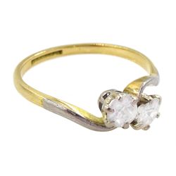 Early 20th century gold two stone old cut diamond crossover ring, stamped 18ct Plat, total diamond weight approx 0.55 carat