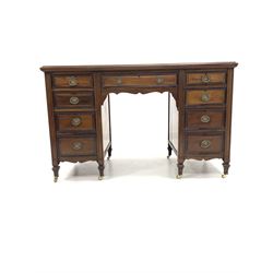 Edwardian mahogany twin pedestal desk, fitted with one long drawer and two banks of four graduating drawers, raised on square tapered supports with brass castors, W122cm, H76cm, D60cm