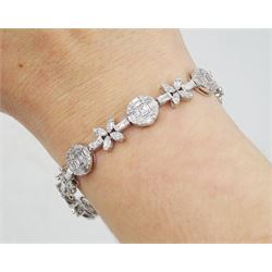 18ct white gold baguette and round brilliant cut diamond flower and circular link bracelet, stamped 750, total diamond weight approx 3.70 carat