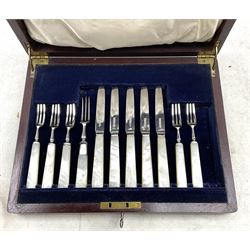 Six silver bladed dessert forks with mother of pearl handles and five matching knives by Mappin & Webb Sheffield 1928, cased and a George IV silver fiddle pattern sifting spoon London 1823 Maker Thomas Wilkes Barker