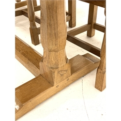 'Eagleman' rectangular oak refectory dining table, adzed top on octagonal shaped supports connected by single floor stretcher, shaped sledge feet (199cm x 90cm, H76cm) and set eight oak dining chairs, panelled backs carved with the Yorkshire rose, leather upholstered seats, by former 'Mouseman' apprentice Albert Jeffray of Sessay, Thirsk