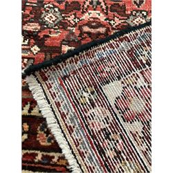Persian Maleyer red ground carpet, lozenge medallion on a busy field enclosed by ivory border 320cm x 162cm