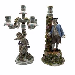 19th century Sitzendorf candlestick with a male figure and applied flowers H37cm, originally a candelabrum, and a Sitzendorf five branch candelabrum with a cherub and applied flowers H37cm