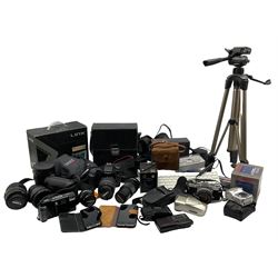 Quantity of cameras and equipment including; Olympus OM-1 SLR in leather case, Canon EOS 40D with Tamron AF lens in case, Olympus 75-150mm lens, Canon 28-80mm lens together with other vintage cameras, phones and equipment in two boxes