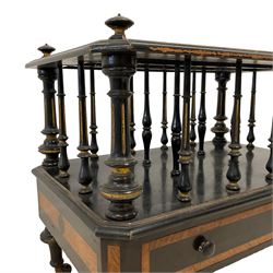 Edwards & Roberts (London 1845-1899) - late 19th century ebonised and parcel gilt Canterbury, with three divisions on turned and fluted supports, canted rectangular form fitted with drawer, with figured bandings, on turned supports with brass and ceramic castors, the drawer stamped 'Edwards & Roberts, Wardour St., London' 