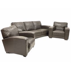 Contemporary three seat sofa, upholstered in brown leather (W218cm) together with a pair of matching armchairs (W90cm)
