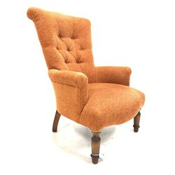 Victorian style high back armchair, upholstered in buttoned fabric, raised on turned front supports 