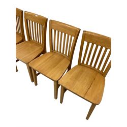 Set four light beech dining chairs, the slatted back over seat, raised on square supports united by stretchers 