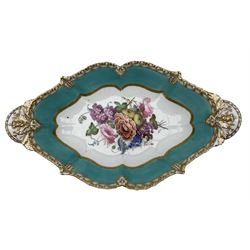 19th century pedestal dish, the bowl of oval form, centrally painted with a floral bouquet within gilt and moulded borders, on a scroll moulded base, W38cm x H16cm 