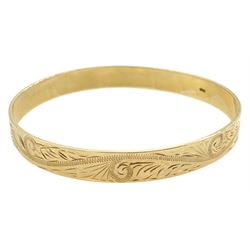9ct gold bangle, with bright cut foliate decoration, stamped 9.375
