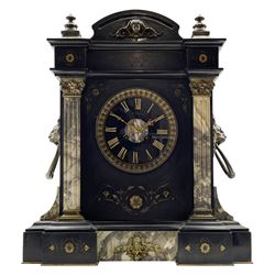 A mid-19th century mantle clock in a Belgium slate case with a French striking movement, breakfront case with a flat top and arched pediment, incised gilt decoration and two reeded variegated marble columns to the front with applied brass ring lion handles to the sides, 6” black slate dial with gold incised Roman numerals and brass fleur di Lis hands, cast bezel with a flat bevelled glass and egg and dart decorated slip, dial inscribed  “J Perry, Paris”, eight-day rack striking movement, striking the hours and half hours on a coiled gong. No pendulum or key.  
French clocks exported to England were frequently signed by the retailer  rather than the actual maker, John Perry (&Son) are recorded as working in London 1839-57 (1863-81).  
