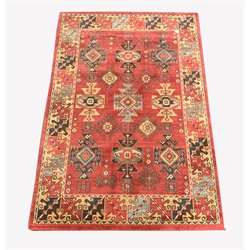 Persian design Heriz red ground rug, with repeating medallion on red field, enclosed by guarded border,  230cm x 158cm