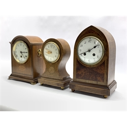 Early 20th century mantel clock with inlaid amboyna panels, eight day striking movement, white enamel dial, (W18cm) together with two other early 20th century inlaid mantel clocks