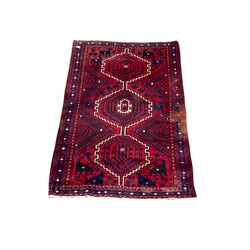 Persian design rug with three central medallions of geometric design with recurring animal motifs and navy border 233cm x 170cm