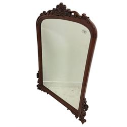 Victorian style mahogany framed wall hanging mirror, the arched top with shell and acanthus leaf pediment over bevelled mirror plate 83cm x 110cm