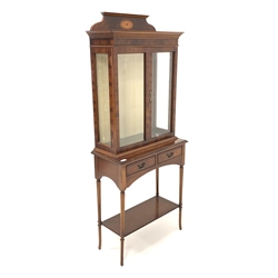 Georgian design mahogany display cabinet, raised back with fan inlay over two bevelled glazed doors enclosing two adjustable glass shelves, two drawers under, raised on turned supports united by under tier 