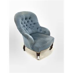 Victorian bedroom chair, upholstered in buttoned blue velvet, raised on turned front supports with ceramic castors 