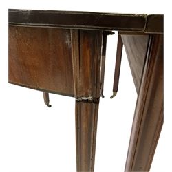 George III mahogany dining table, raised on square tapering supports, terminating in brass castors 