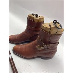 Pair of tan leather boots and wooden tree inserts, together with a shooting stick