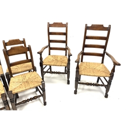  Set eight (6+2) oak rail back country chairs, with rush seats raised on turned front supports united by stretchers, W62cm  