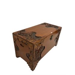 Carved camphor wood blanket box with oriental carved scenes 