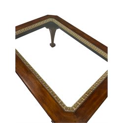 Mahogany coffee table, canted rectangular top with glass inset, the frieze with dentil decoration, on acanthus carved cabriole supports with ball and claw feet