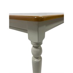 Contemporary dining table, the beech top over painted base, raised on turned supports 