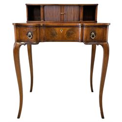 19th century yew wood bonheur du jour or lady's writing desk, raised back with tambour roll revealing pigeon holes, the front fascias with square column pilasters, shaped top and front fitted with single drawer, on tapering cabriole supports carved with scrolls