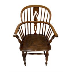 19th century low back Windsor armchair, the spindle and splat back over elm seat, raised on turned supports, united by a stretcher 
