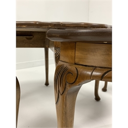 Early 20th century walnut nest of five tables, the larger circular table with pie crust top, and all raised on leaf carved cabriole supports 