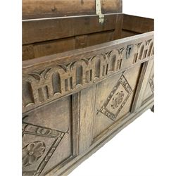 18th century carved oak blanket chest, the three panelled lifting lid over base with carved diamond panels, raised on stile supports 