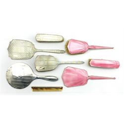 Silver and pink enamel  dressing table set Birmingham 1932 Maker Barker Bros., engine turned silver backed three piece dressing table set Birmingham 1948, silver backed mirror and a comb