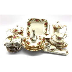 Quantity of Royal Albert 'Old Country Roses' pattern tableware including five cups, eight saucers, four tea plates, four dessert plates, four bowls, milk jug, sugar bowl, teapot, coffee pot, cake plate, serving bowl, small vase H13cm, trinket dish, small oval dish and a swan tooth pick holder (35)