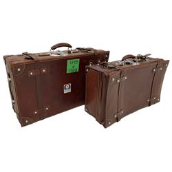 Graduating pair mid-20th century leather suitcases, with cream stitching (2)