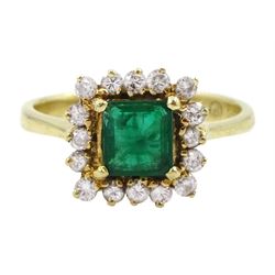 Gold rectangular cut emerald and round brilliant cut diamond cluster ring