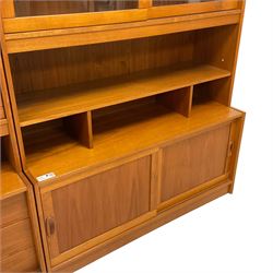Mid-20th century teak two sectional wall unit, fitted with fall front, sliding glass doors, sliding panelled doors, shelves and drawers
