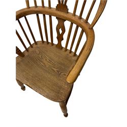 19th century low back Windsor armchair, the splat and spindle back over elm seat, raised o turned supports united by H stretcher 
