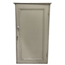 Cream painted cabinet, with one hinged door opening to reveal two fixed shelves 