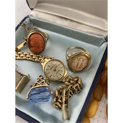 Gold coral ring, cameo ring, three gold charms, Chateau manual wind wristwatch, on gold strap, all 9ct, 18ct gold cameo brooch, 15ct gold cameo brooch, both stamped, amber bead necklace and a collection of costume jewellery and wristwatches