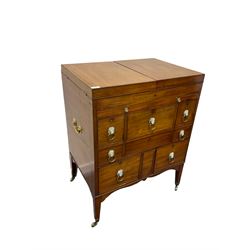 Regency mahogany washstand, with pivoting hinged lid above an arrangement of small drawers with lion mask loop handles