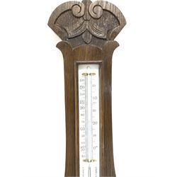 Edwardian carved oak aneroid wheel barometer and thermometer in banjo pattern case, with white porcelain registers 