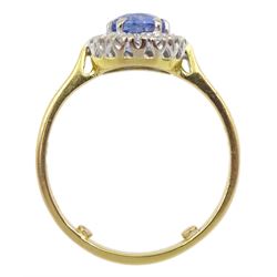 18ct gold oval light blue Ceylon sapphire and round brilliant cut diamond cluster ring, London 1995, sapphire approx 1.60 carat