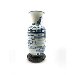 20th century Chinese blue and white vase decorated with a scene of figures in a courtyard setting, Kangxi mark beneath, on stand H32cm 