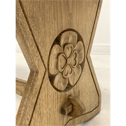 Yorkshire oak coffee table, the rectangular top raised on shaped panel end supports carved with Yorkshire rose roundels, united by pegged stretcher, carved with initials JN