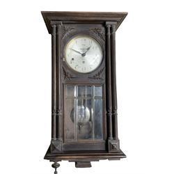 French - Westminster chiming 8-day three train wall clock in a stained oak case.c1920.