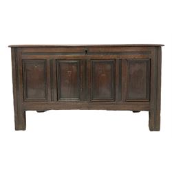 18th century panelled oak blanket chest, the hinged lifting lid opening to reveal storage space over panelled base with 'TL' inscription, raised on stile supports 