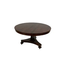 Early 19th century rosewood breakfast table, circular tilt-top on nonagonal pedestal column, concave triangular form pedestal, turned feet on brass castors