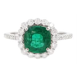 18ct white gold cushion cut emerald and round brilliant cut diamond cluster ring, stamped 750, emerald approx 1.85 carat, total diamond weight approx 0.55 carat