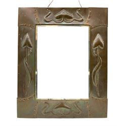 Art Nouveau upright wall mirror with bevelled plate and copper frame with a raised pattern of stylised flowers 47cm x 38cm overall