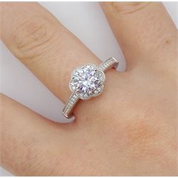 Silver cubic zirconia flower cluster ring, with stone set shoulders, stamped 925